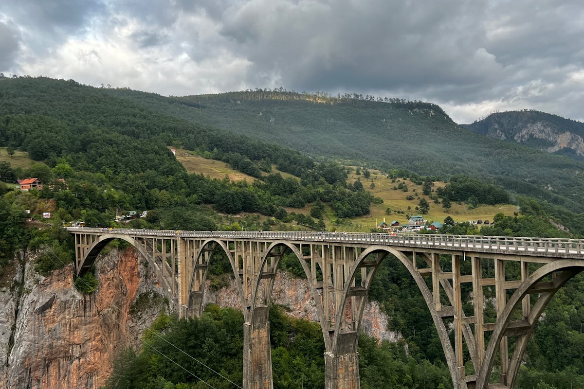 Morača Canyon road with vertical limestone walls and river below
